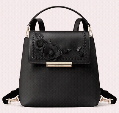 A Black Purse With Flowers On It And The Word Kate Spade On The Front GIF