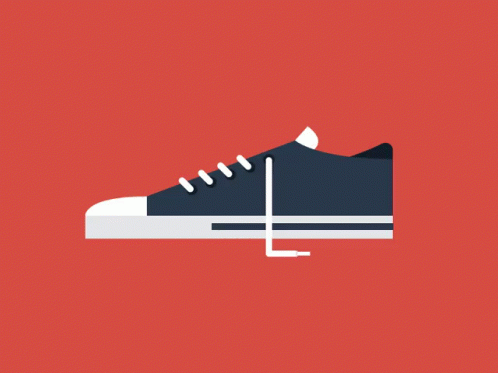 A Black Shoe With White Laces On A Red Background . GIF