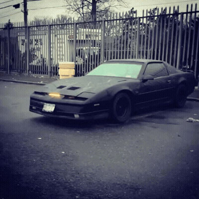 A Black Sports Car With A License Plate That Says Tnc 929 GIF