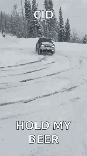 A Black Truck Is Driving Through The Snow With The Words Hold My Beer Written On The Bottom GIF