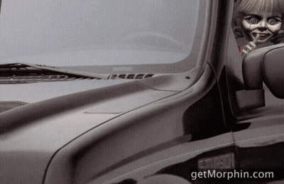 A Black Truck With A Doll Sticking Out Of The Window And The Website Getmorphin.com GIF