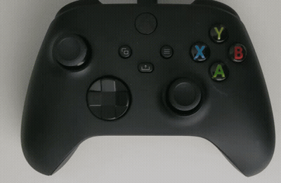 A Black Xbox Controller With A White X In The Center GIF