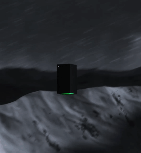 A Black Xbox With A Green Controller On The Side GIF