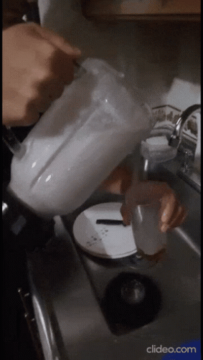 A Blender Is Being Poured Into A Sink With A Clipeo.com Watermark In The Corner GIF