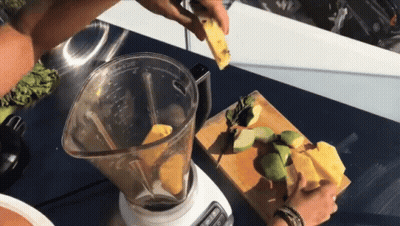A Blender Is Being Used To Make A Smoothie With A Pineapple In It GIF