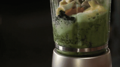 A Blender Is Filled With A Green Smoothie GIF