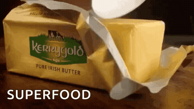 A Block Of Kerrygold Pure Irish Butter Being Opened GIF