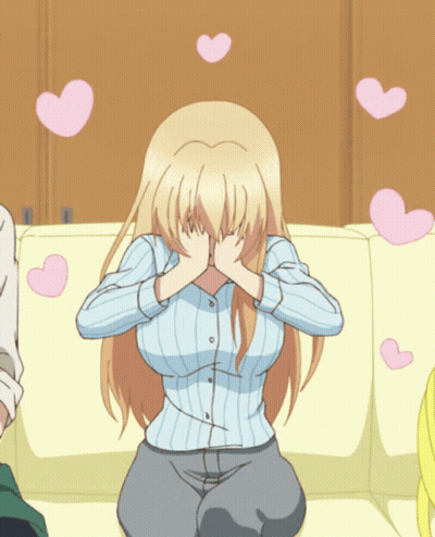 A Blonde Anime Girl Covering Her Face With Her Hands With Pink Hearts Flying Around Her GIF