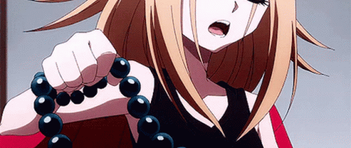 A Blonde Anime Girl Is Crying While Holding A Necklace Of Black Beads . GIF