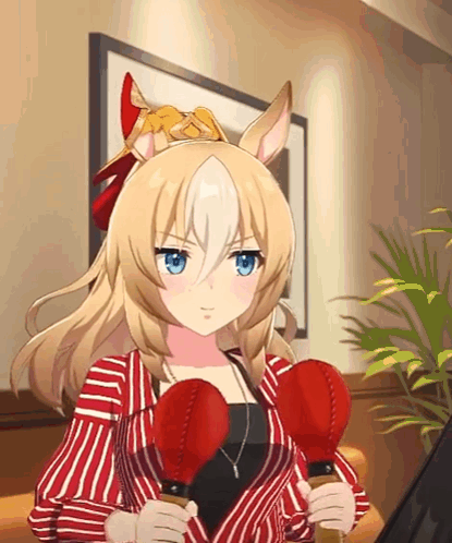 A Blonde Anime Girl Is Holding Two Red Boxing Gloves In Her Hands GIF