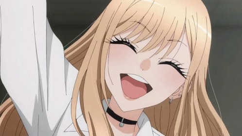 A Blonde Anime Girl With A Choker On Her Neck Is Smiling GIF