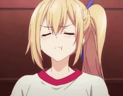 A Blonde Anime Girl With A Ponytail And A Red Shirt Is Making A Funny Face . GIF