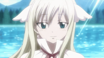A Blonde Anime Girl With White Ears Is Smiling In Front Of A Body Of Water GIF