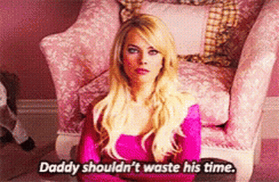 A Blonde Woman Is Sitting In A Pink Chair And Says Daddy Shouldn 'T Waste His Time GIF