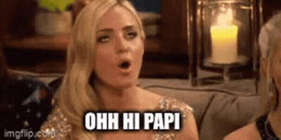 A Blonde Woman Is Sitting On A Couch With Her Mouth Open And A Candle In The Background . GIF