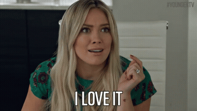A Blonde Woman Says I Love It In A Green Shirt GIF