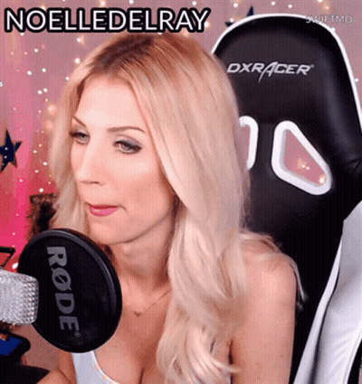 A Blonde Woman Sitting In A Dxracer Chair With The Name Noelledelray Written Above Her GIF