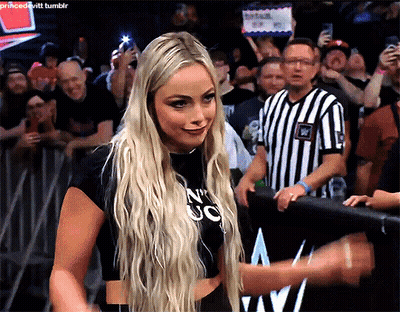 A Blonde Woman Wearing A Black Shirt That Says N ' Uc On It GIF