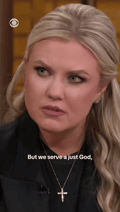 A Blonde Woman Wearing A Cross Necklace Says But We Serve A Just God GIF