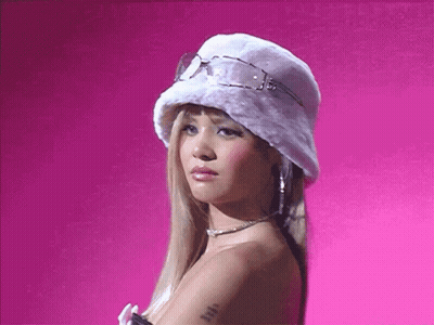 A Blonde Woman Wearing A White Hat And Sunglasses GIF