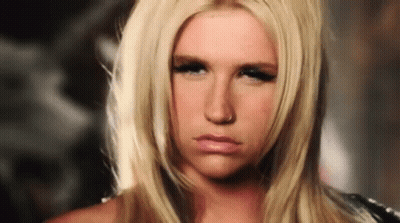 A Blonde Woman With A Nose Ring Is Making A Serious Face GIF