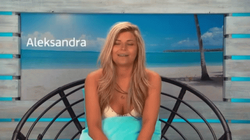 A Blonde Woman With The Name Aleksandra On The Bottom Right GIF