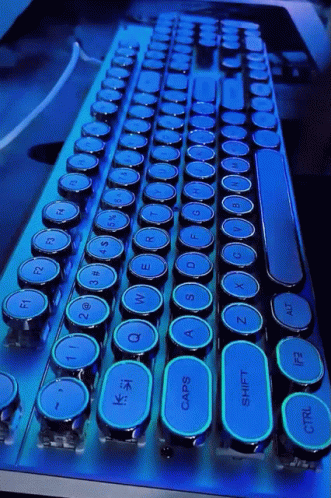 A Blue And Black Keyboard With A Shift Key In The Middle GIF