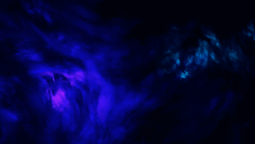 A Blue And Purple Smoke Coming Out Of A Dark Background GIF