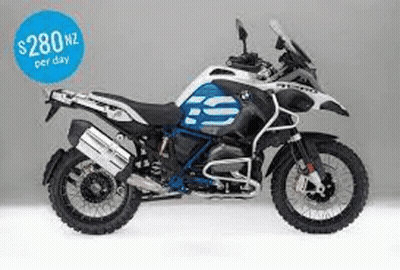 A Blue And White Bmw Gs Adventure Motorcycle Is Sitting On A White Surface . GIF