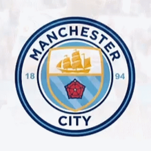 A Blue And White Manchester City Logo With A Ship On It GIF