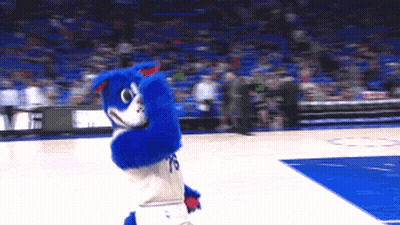 A Blue And White Mascot With The Number 19 On His Shorts GIF