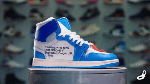 A Blue And White Shoe That Says Off White For Nike GIF