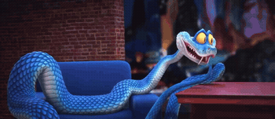 A Blue And White Snake Is Sitting On A Couch GIF