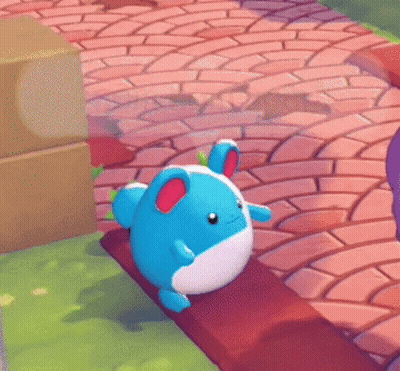 A Blue And White Stuffed Animal Is Sitting On A Bench With A Speech Bubble That Says " Nom Nom Nom " GIF
