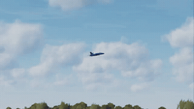 A Blue And Yellow Airplane With The Letters Us Navy On The Side Of It GIF