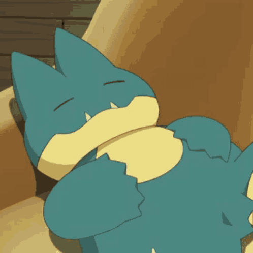 A Blue And Yellow Cartoon Character Is Laying On A Couch GIF