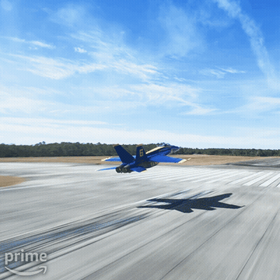 A Blue And Yellow Fighter Jet Is Taking Off From A Runway With The Word Prime On The Bottom Right GIF