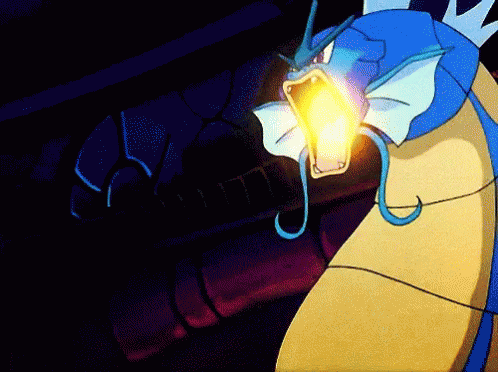A Blue And Yellow Pokemon With A Light Coming Out Of It 'S Mouth GIF