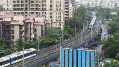 A Blue And Yellow Train With The Letter T On The Side GIF
