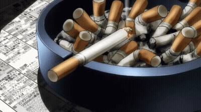 A Blue Ashtray Filled With Cigarettes And A Broken Cigarette On Top GIF