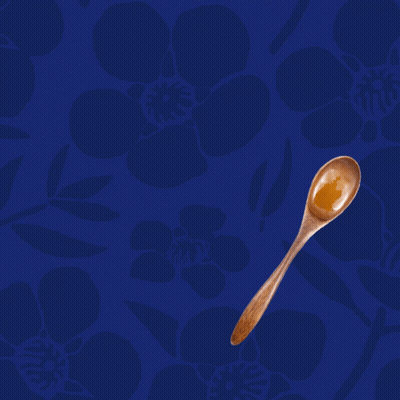 A Blue Background With A Wooden Spoon And The Words " One Spoon A Day " GIF