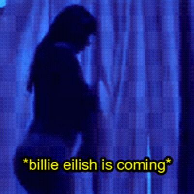 A Blue Background With The Words Billie Eilish Is Coming Written On It GIF