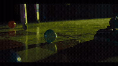 A Blue Ball Is Being Thrown Into A Green Liquid GIF