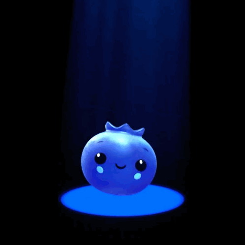 A Blue Ball With A Face On It Is Sitting In A Spotlight GIF