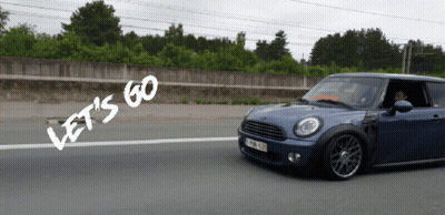 A Blue Car Is Driving Down A Road With The Words Let 'S Go Written On The Side GIF