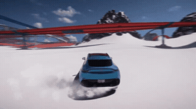 A Blue Car Is Driving Down A Snowy Road With Mountains In The Background GIF