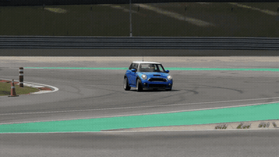 A Blue Car Is Driving On A Race Track GIF