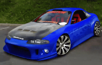 A Blue Car Is Parked In A Parking Lot And Has A Sticker On The Windshield That Says Spitfire On It GIF