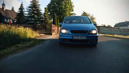 A Blue Car With A License Plate That Says Ezd 4Sa5 GIF