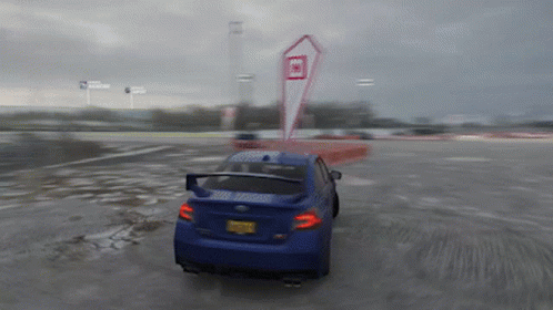 A Blue Car With A New York License Plate Is Driving Down A Wet Road GIF